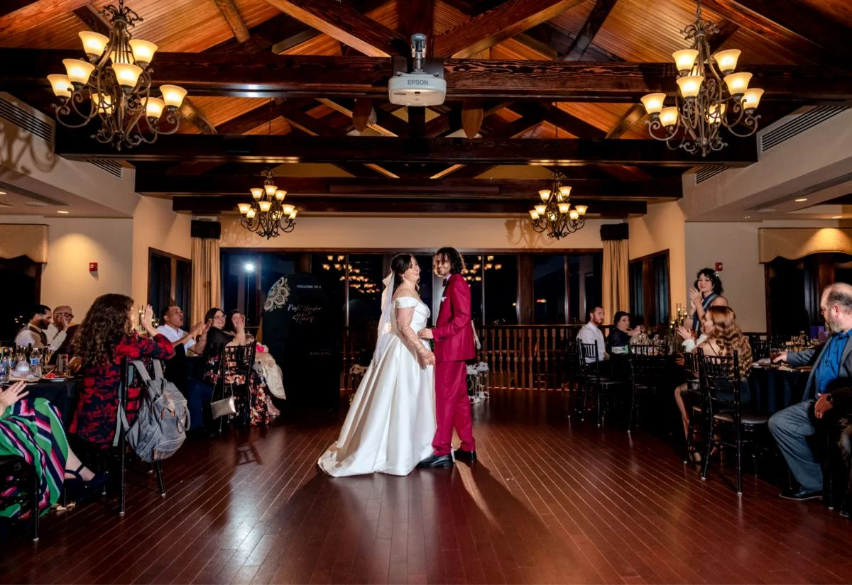 Reception dancing in the warm-lit ballroom