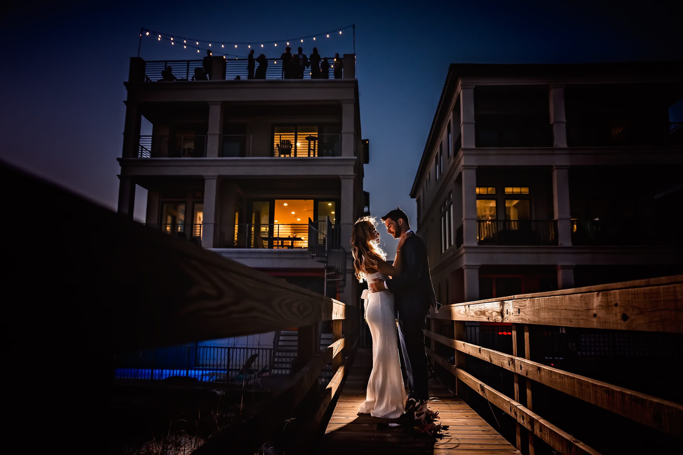 Couple at a waterfront venue in blue hour