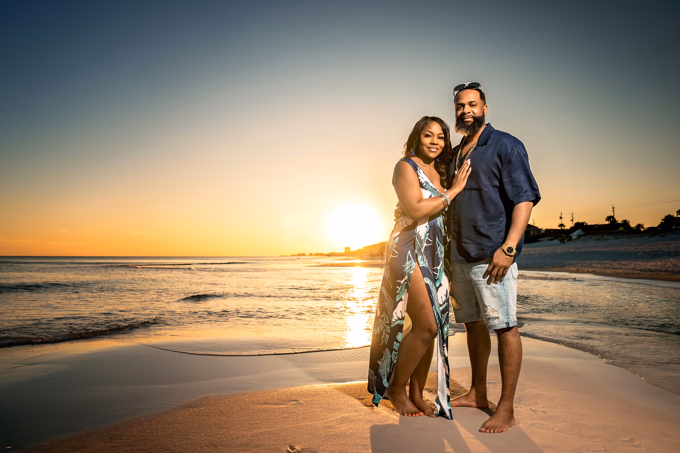 Couple in a sunset embrace on the beach
