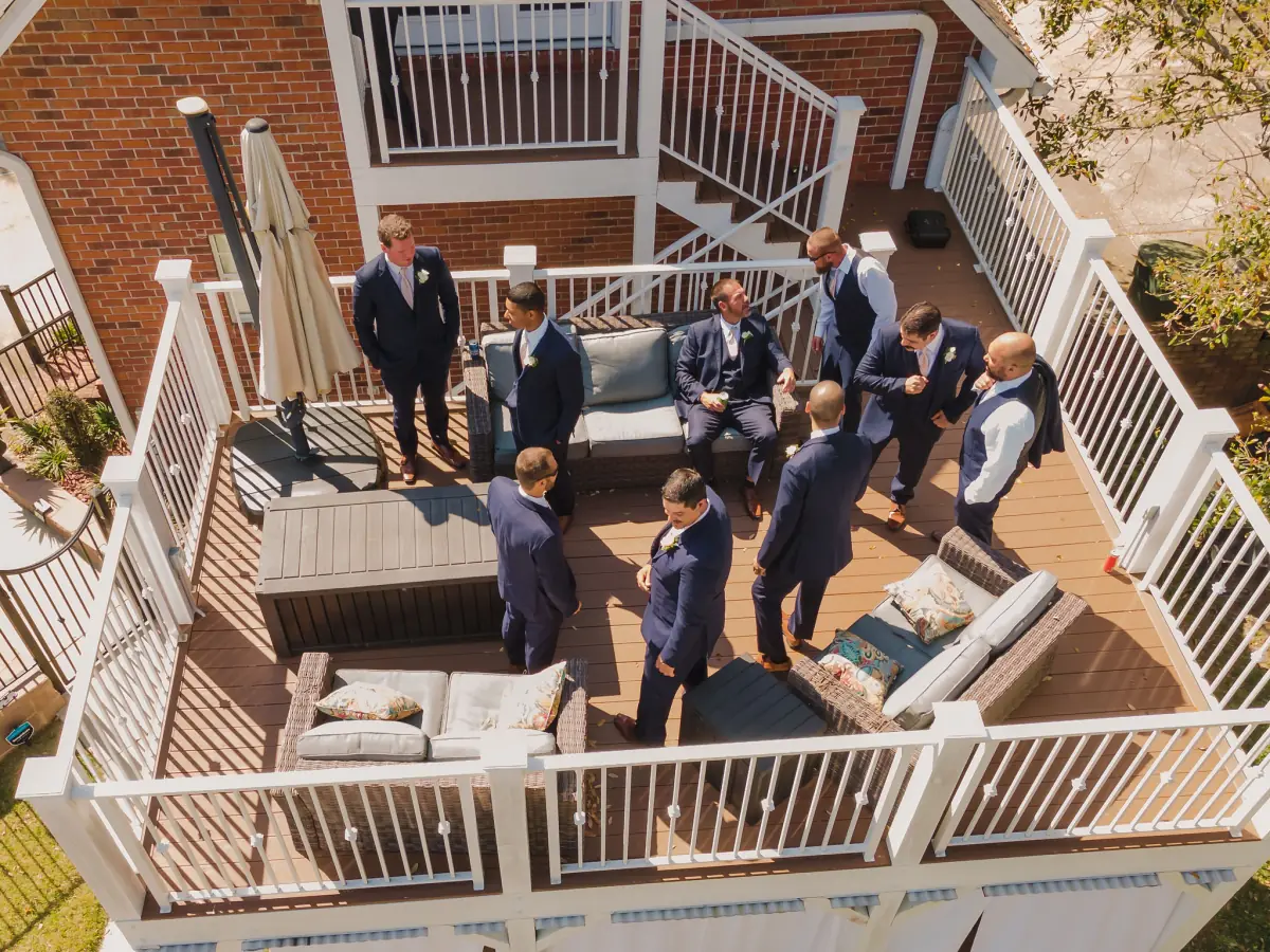 Elevated view of guests on the white veranda at Live Oak Plantation