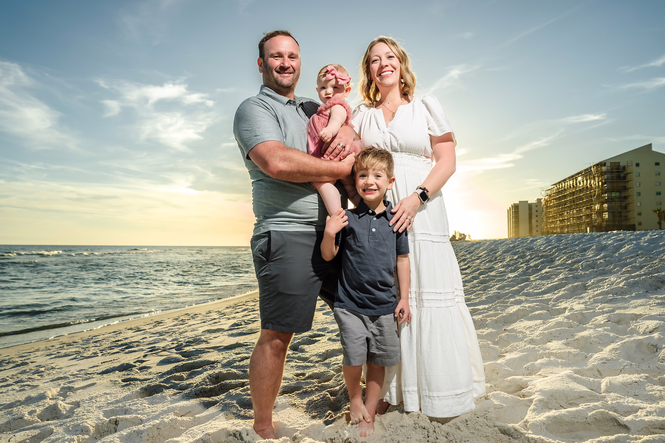 Parents and their two children on the beach