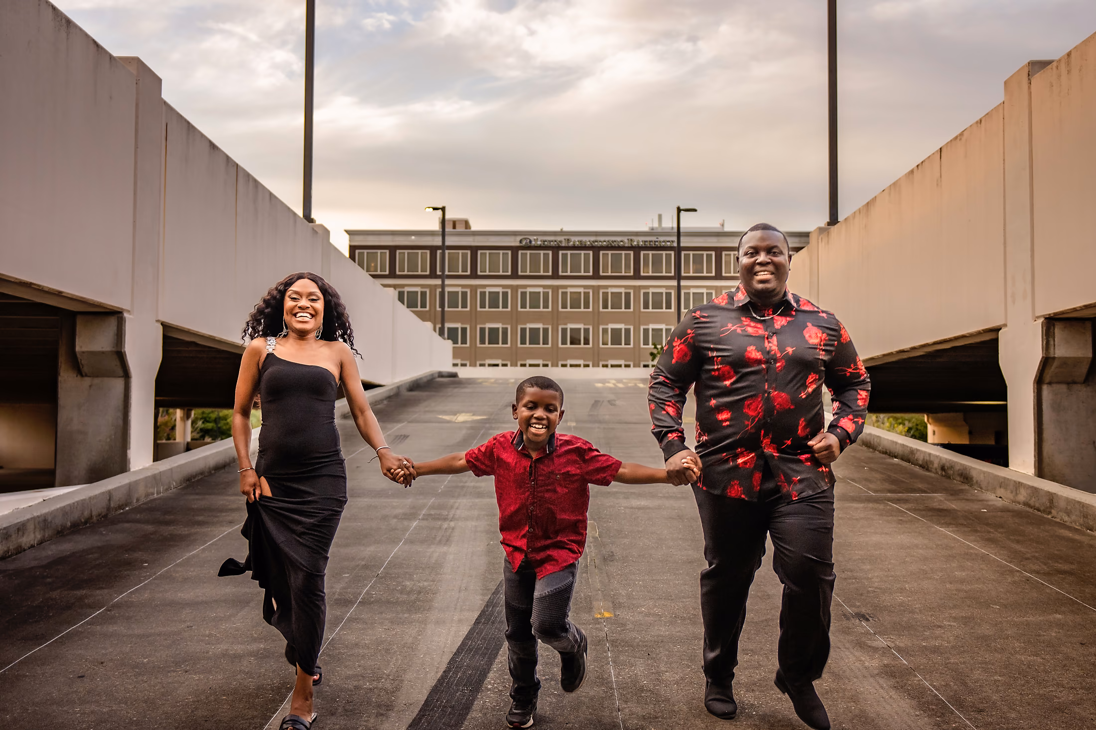 Family walking a boardwalk as their son runs ahead