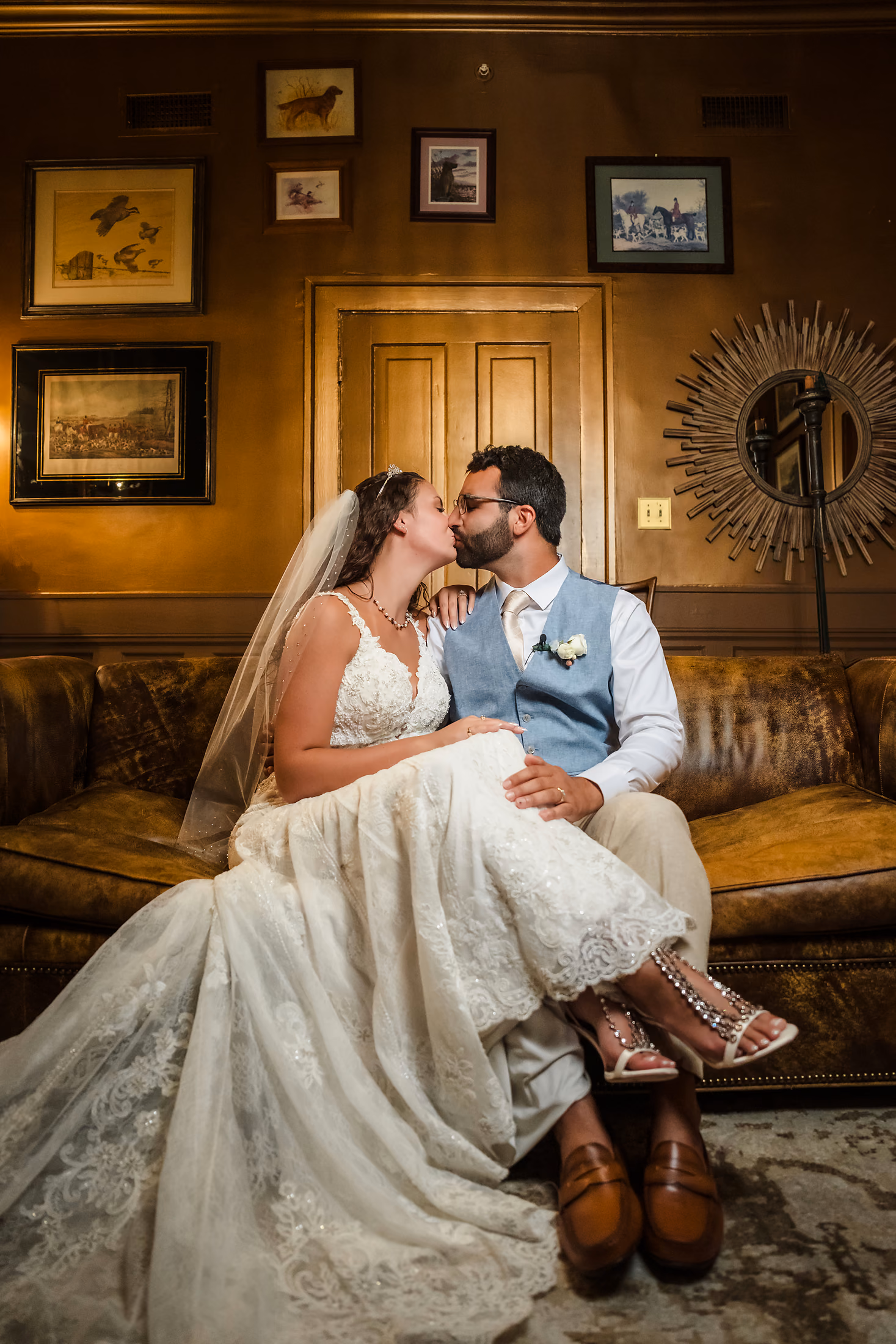Groom lifting his bride in a warm room