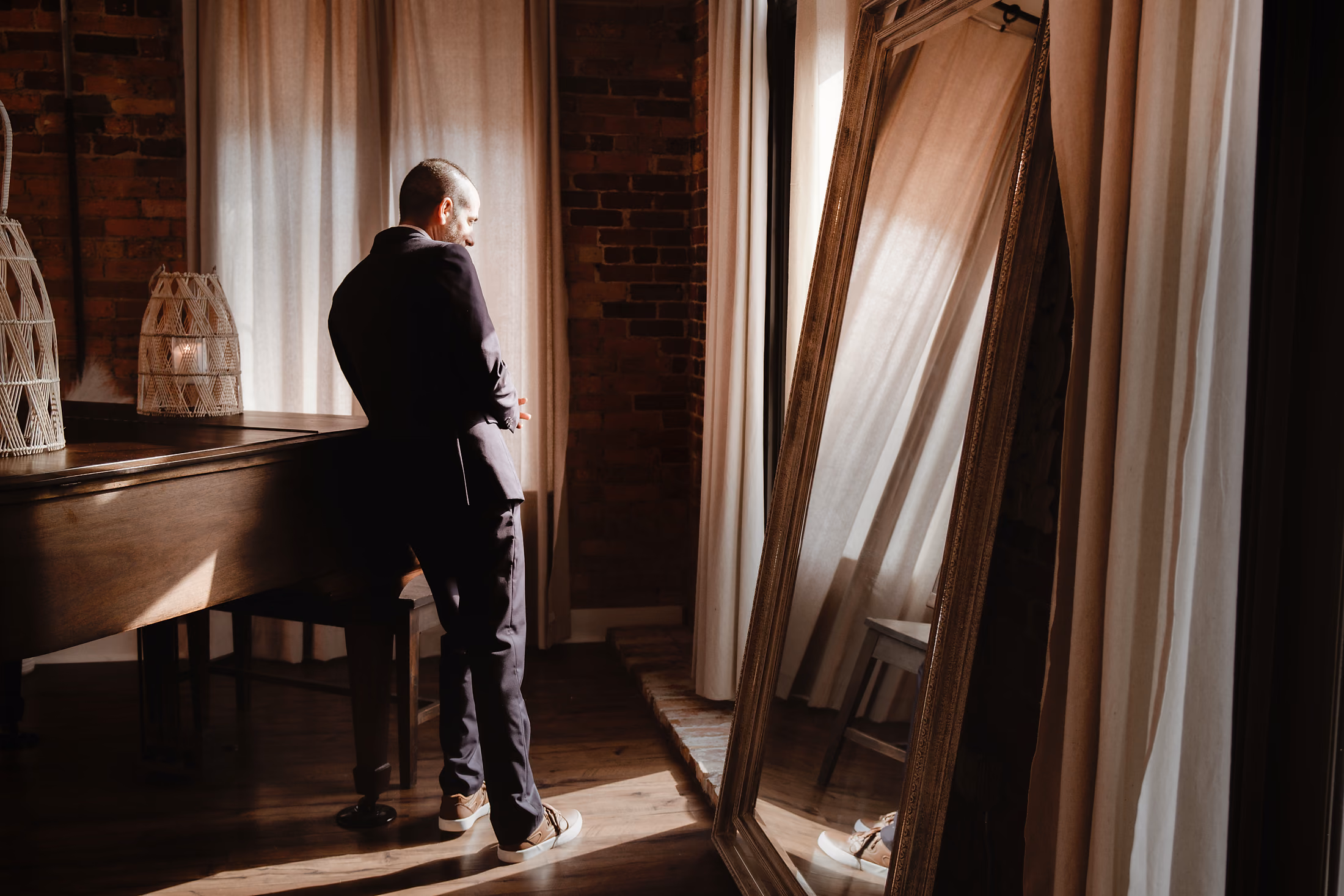 Groom contemplative by the window