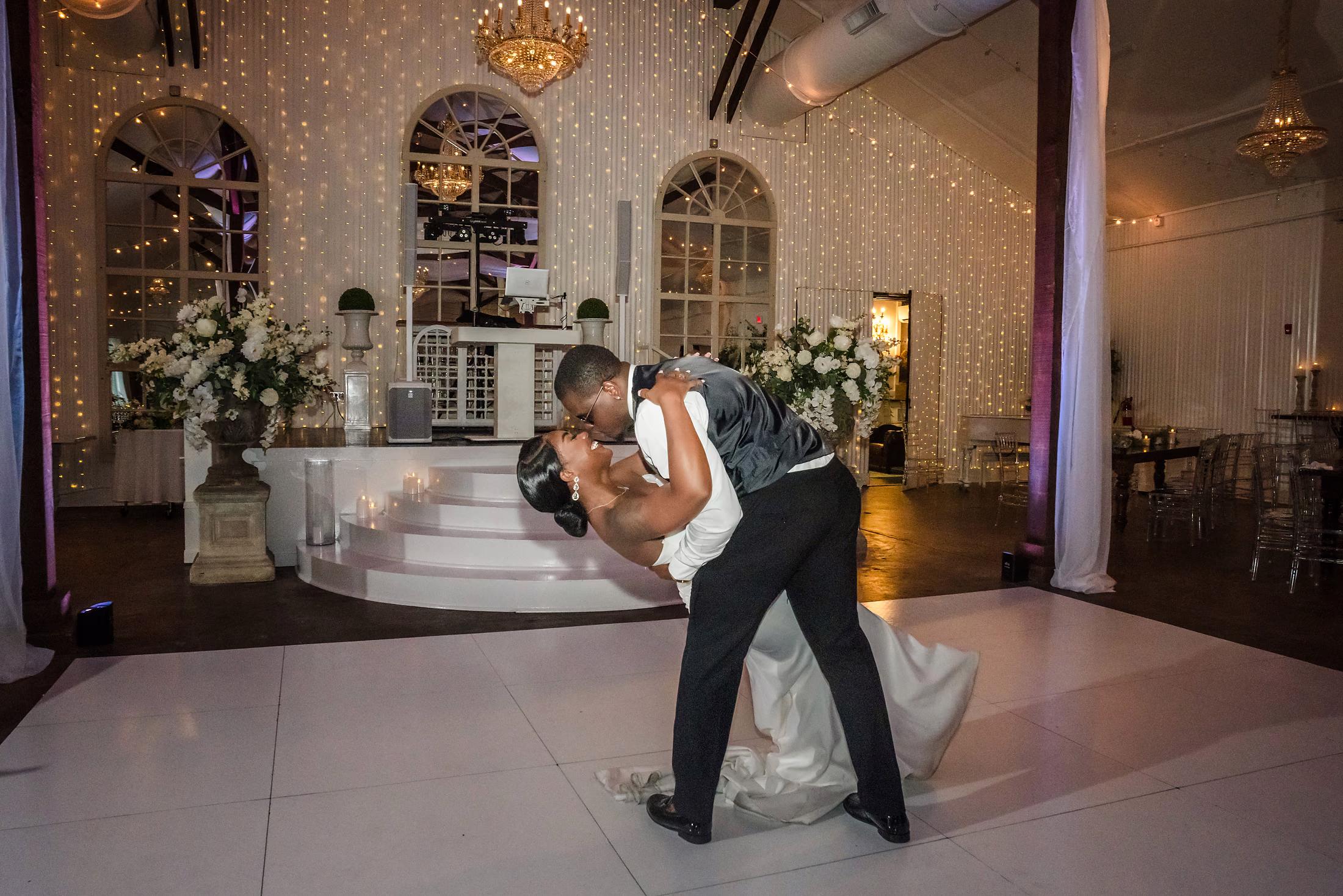 Couple dancing beneath the chandelier
