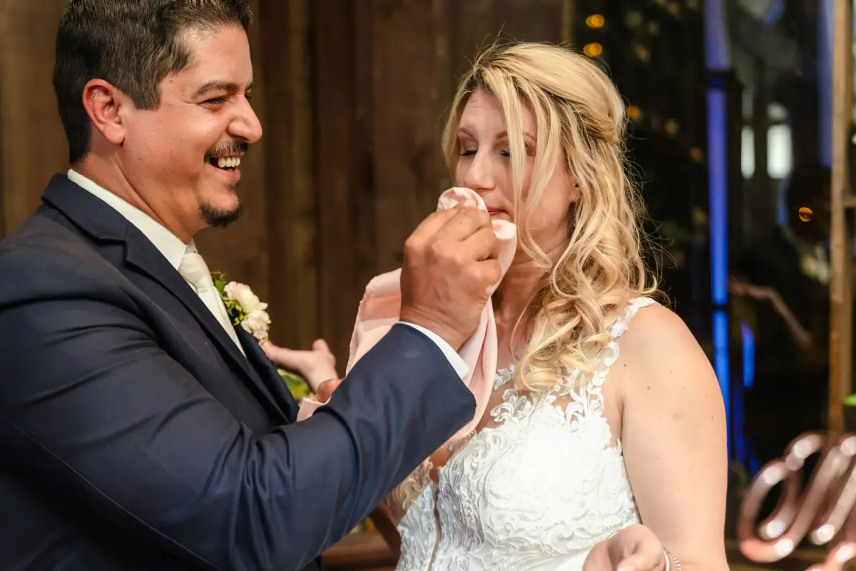 A slow dance held close in the warm light of the reception