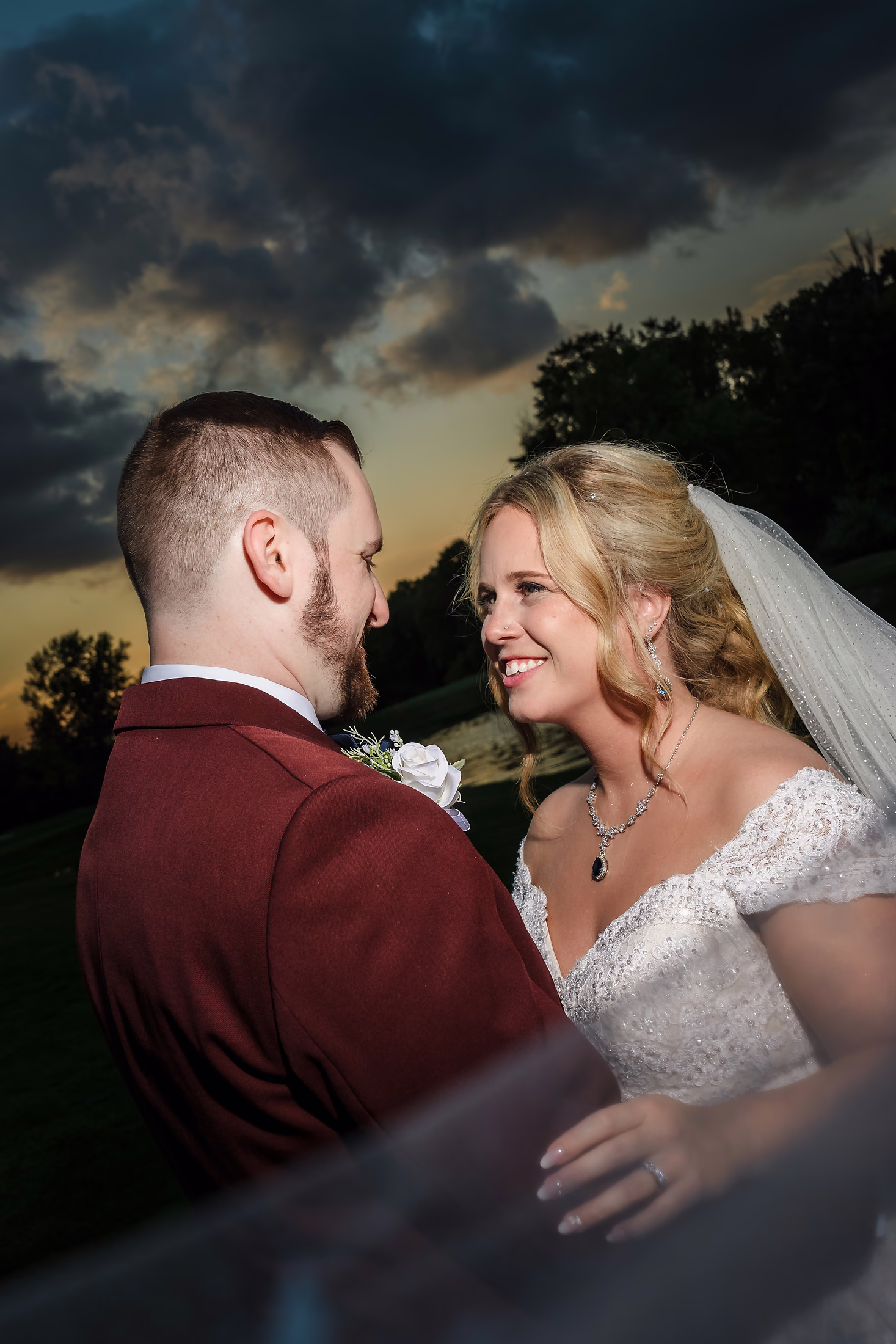 Couple embracing under a dusky sky