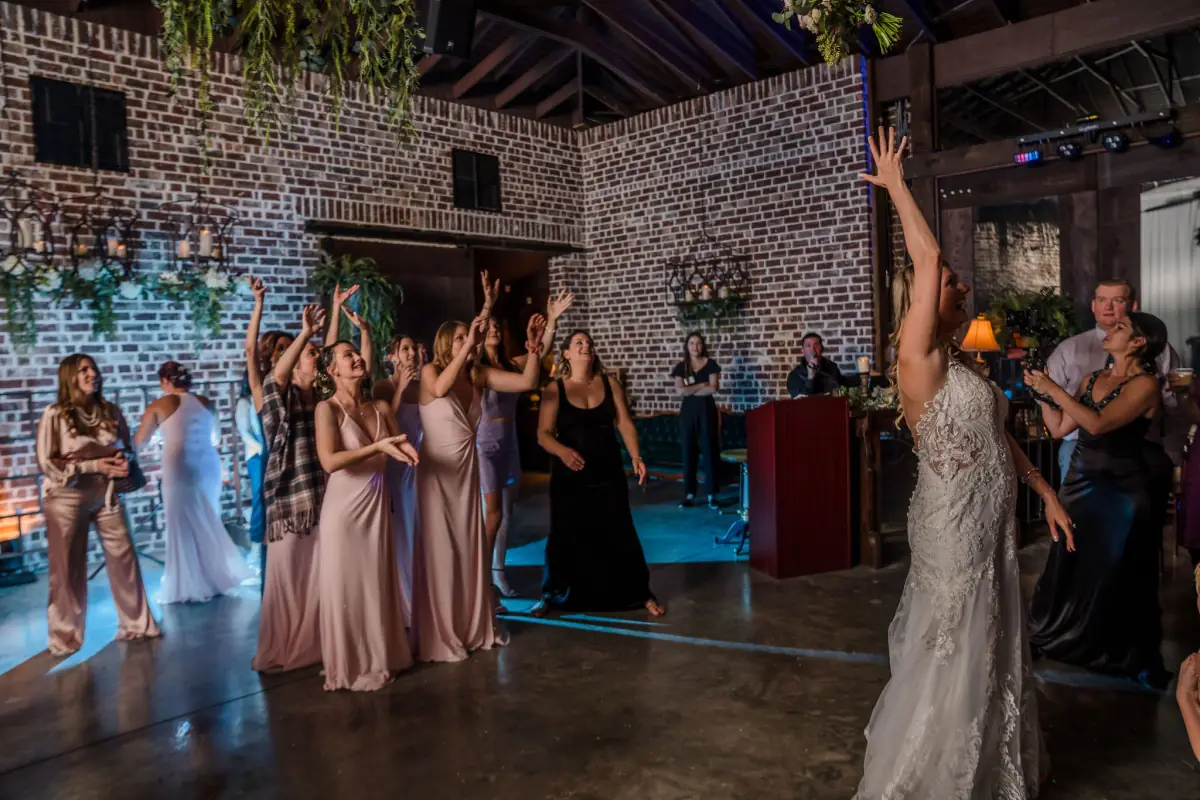 Guests reaching for the bouquet toss at Live Oak Plantation