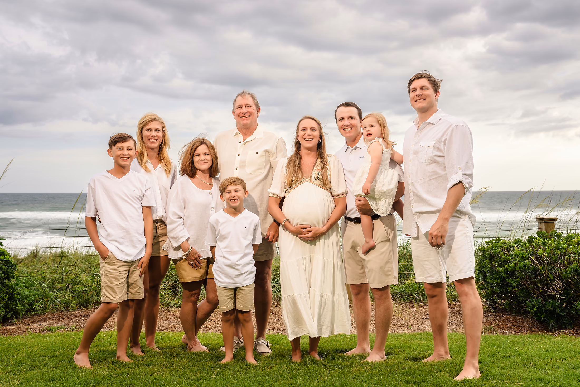 Family gathered on the lawn with a beach ball