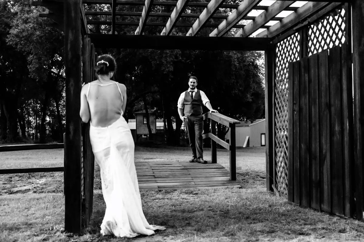 Black-and-white couple under the pergola