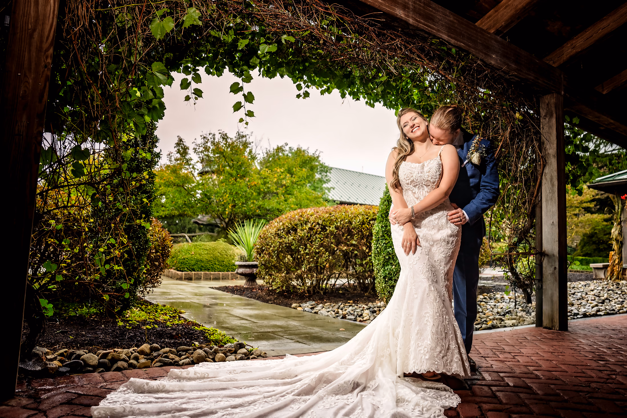 Couple beneath a garden pergola