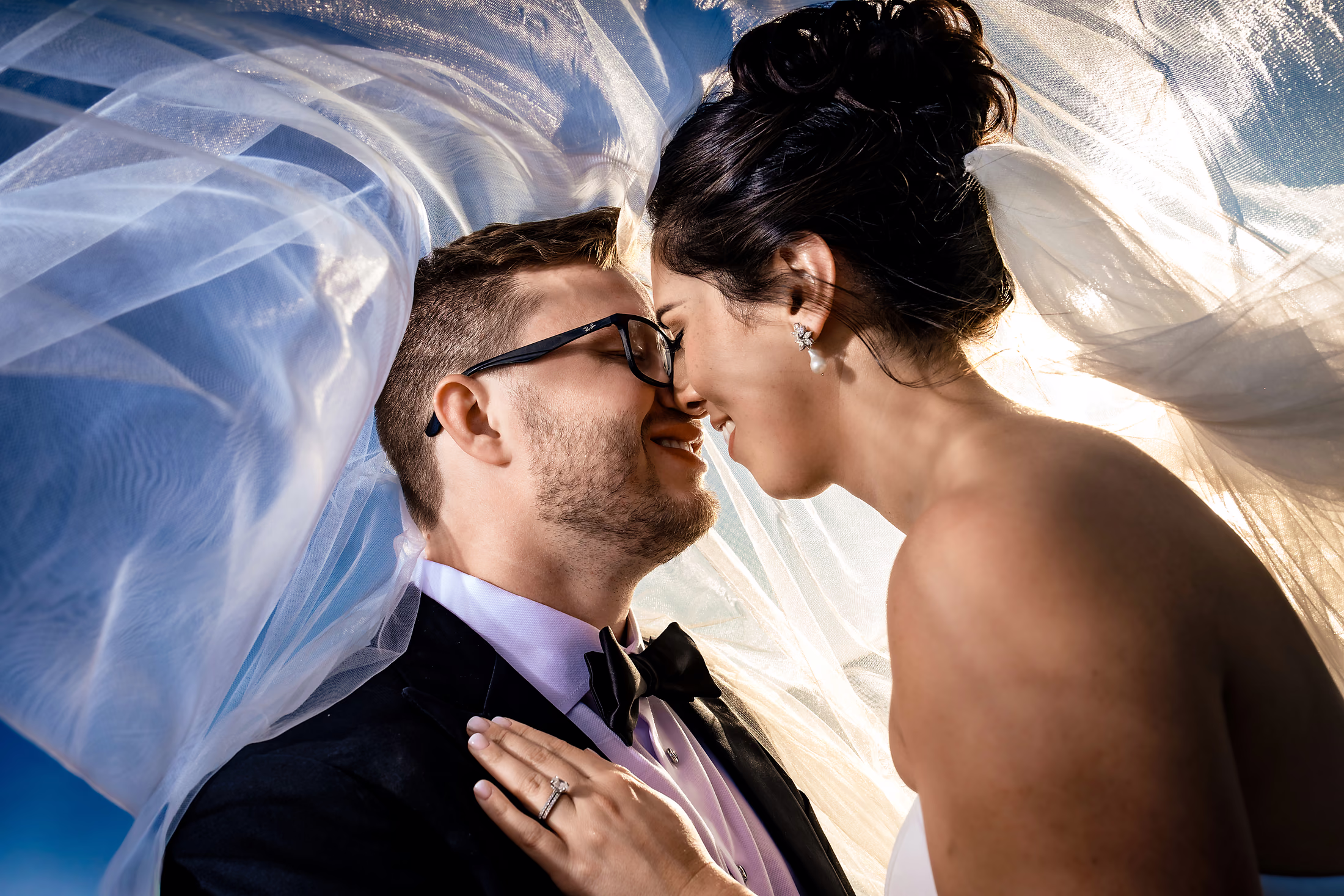 Couple kissing in warm window light