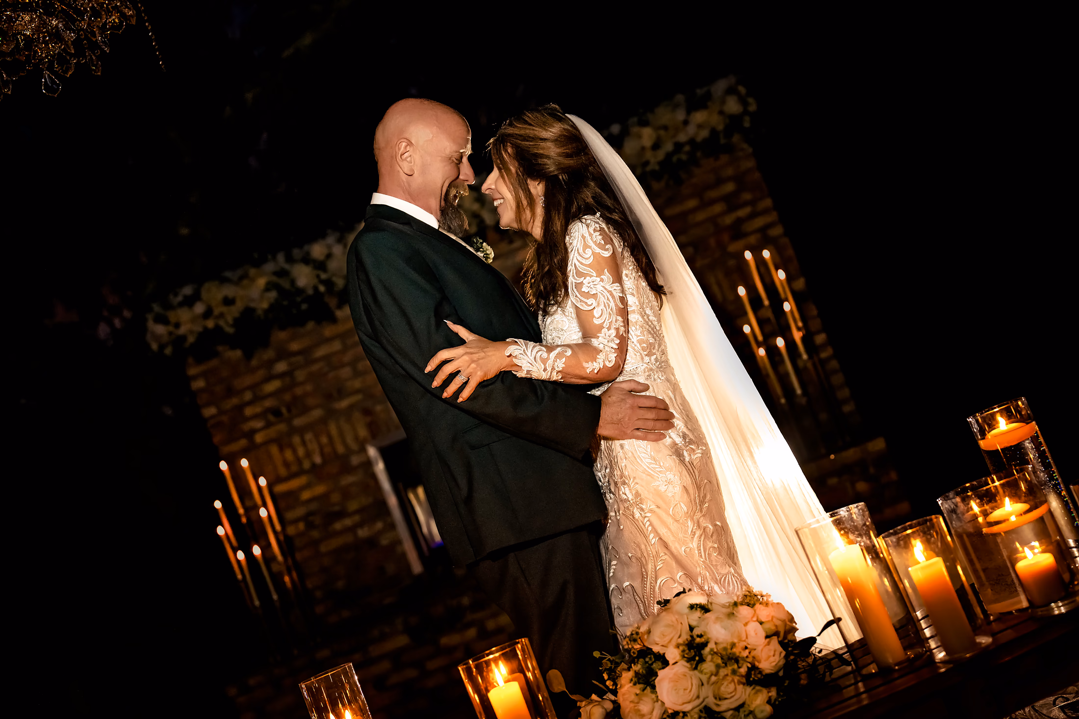 Couple kissing beneath the string lights
