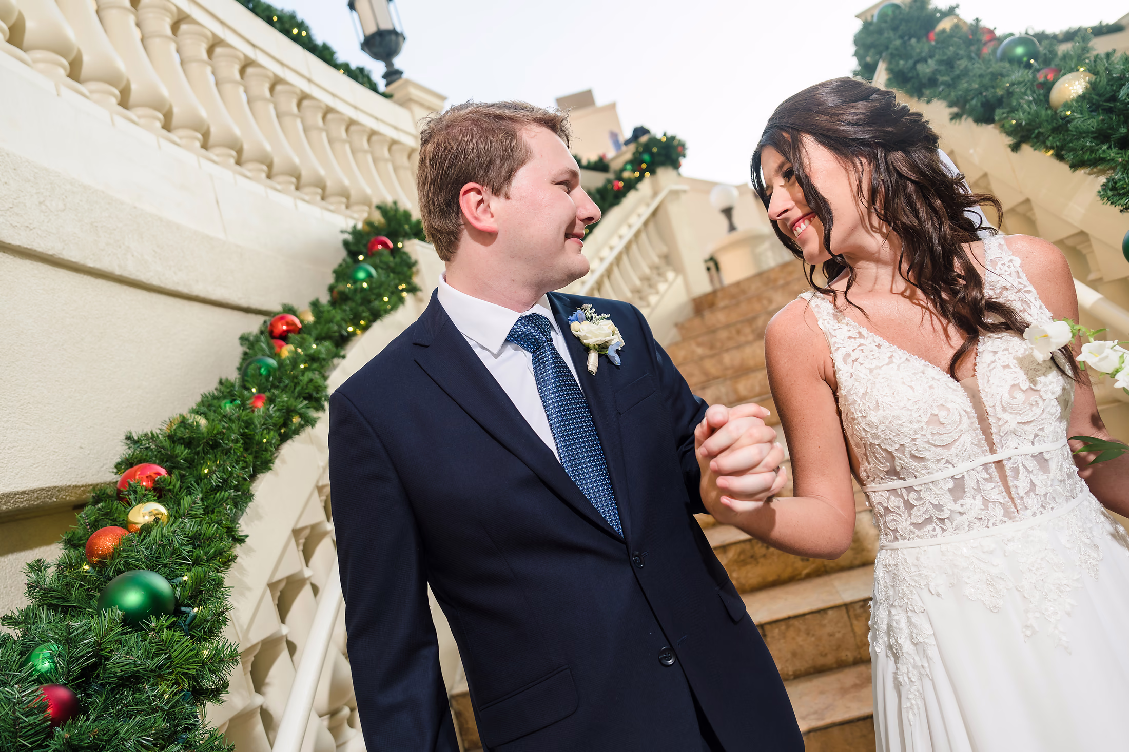 Couple laughing with drinks on the terrace