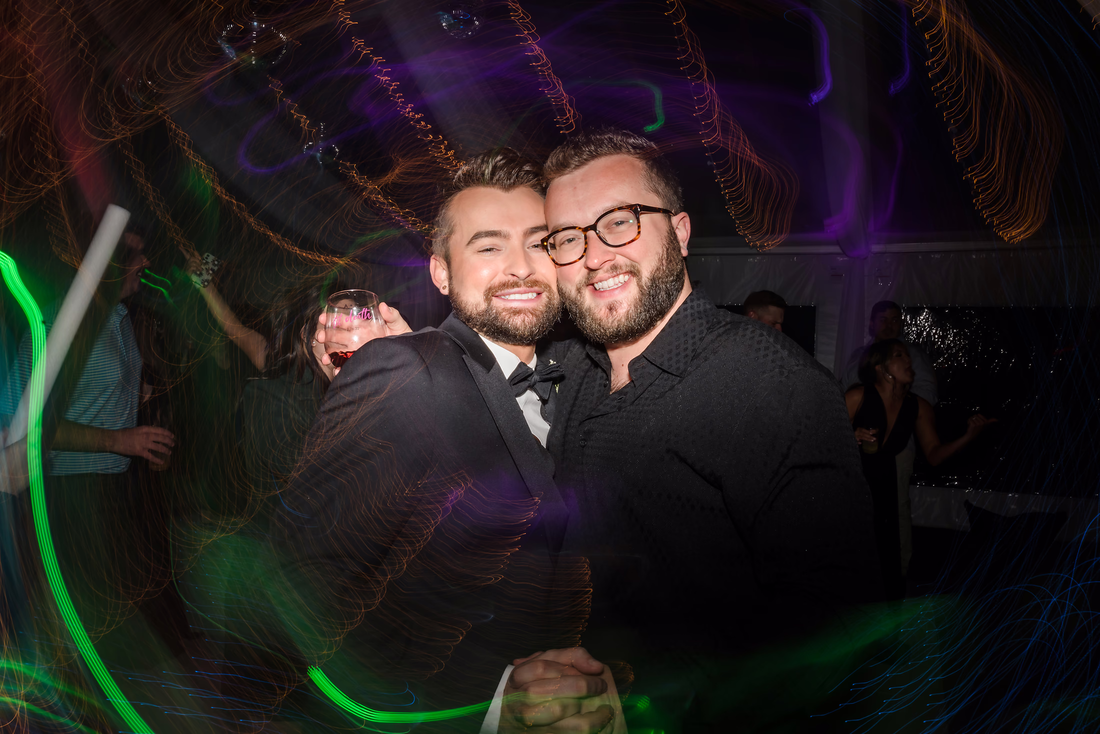 Couple dancing in a swirl of green light