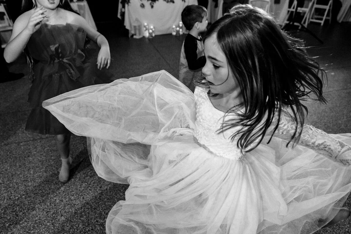 Black-and-white bride twirling her gown