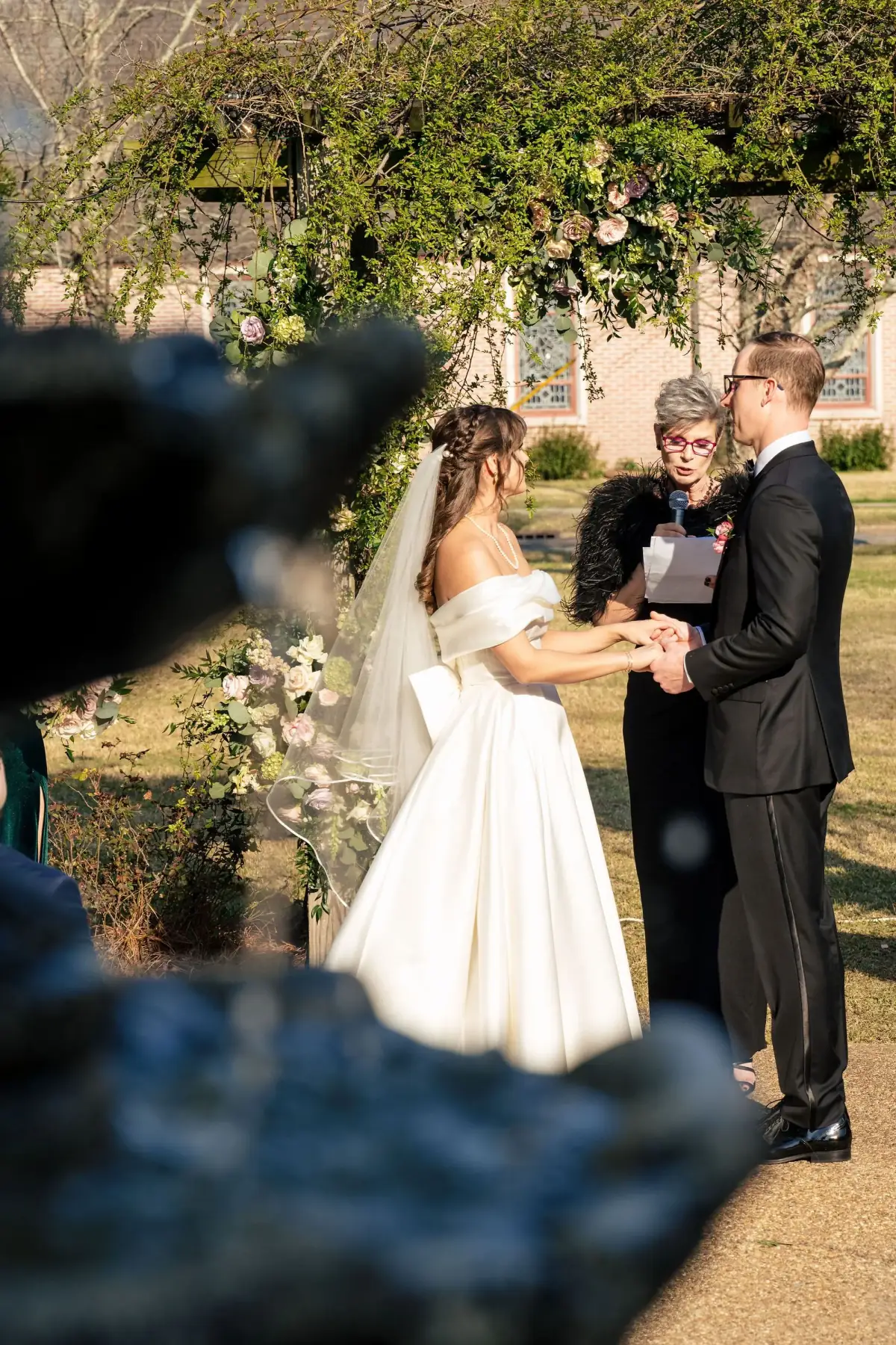 Couple kissing beneath the oak at golden hour