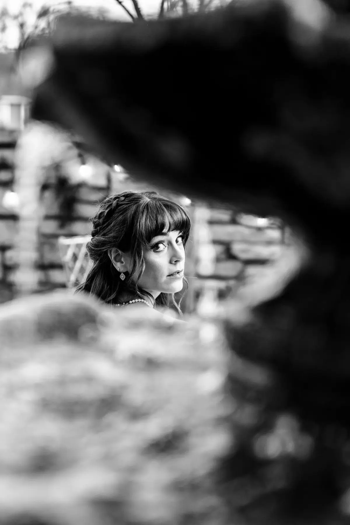 Moody black-and-white portrait in low light