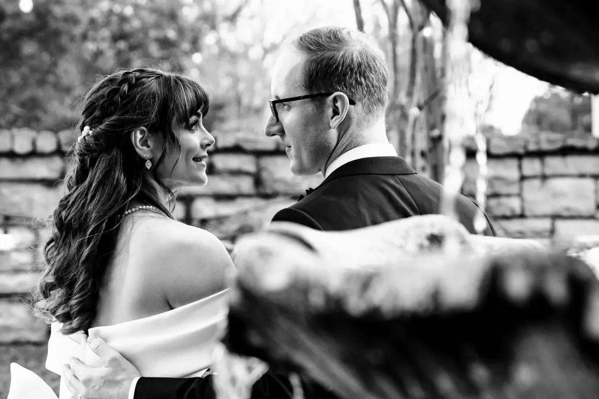 Black-and-white kiss among the greenery