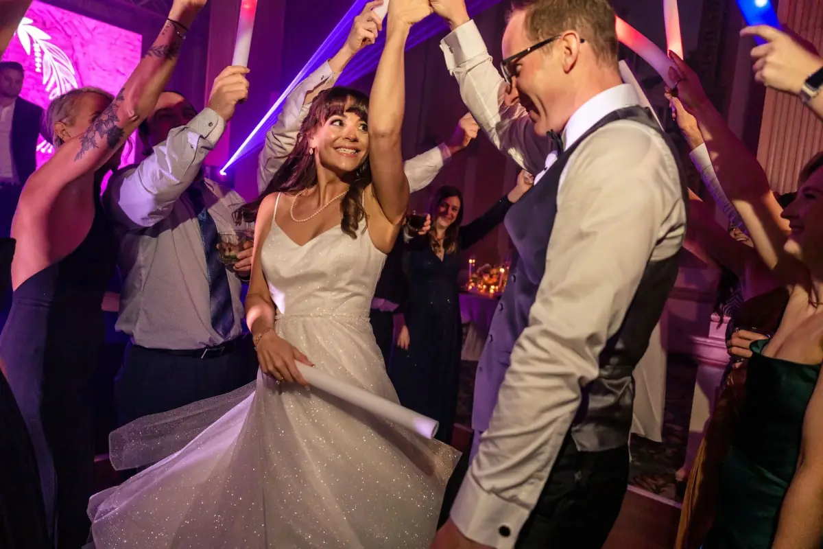Guests dancing with hands in the air