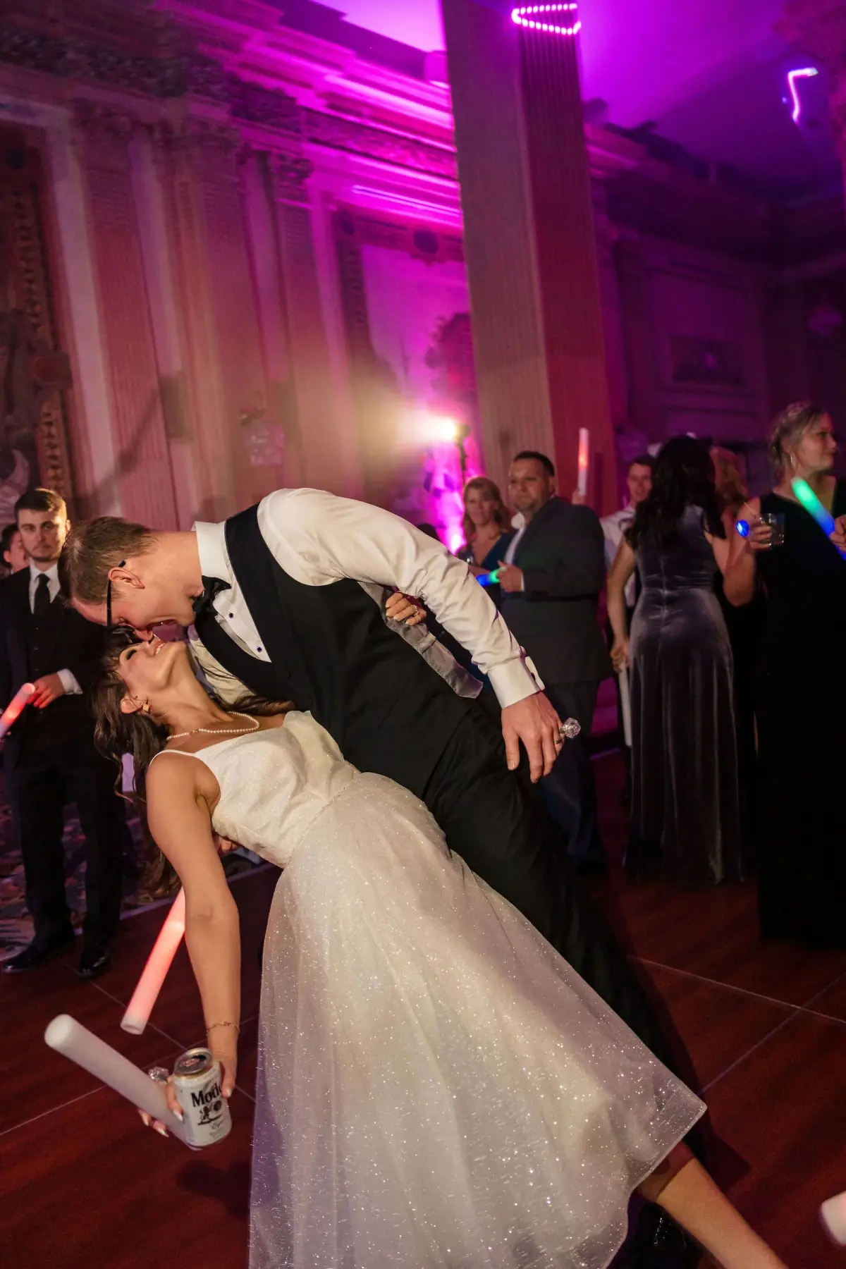 Dip kiss on the dance floor in purple light