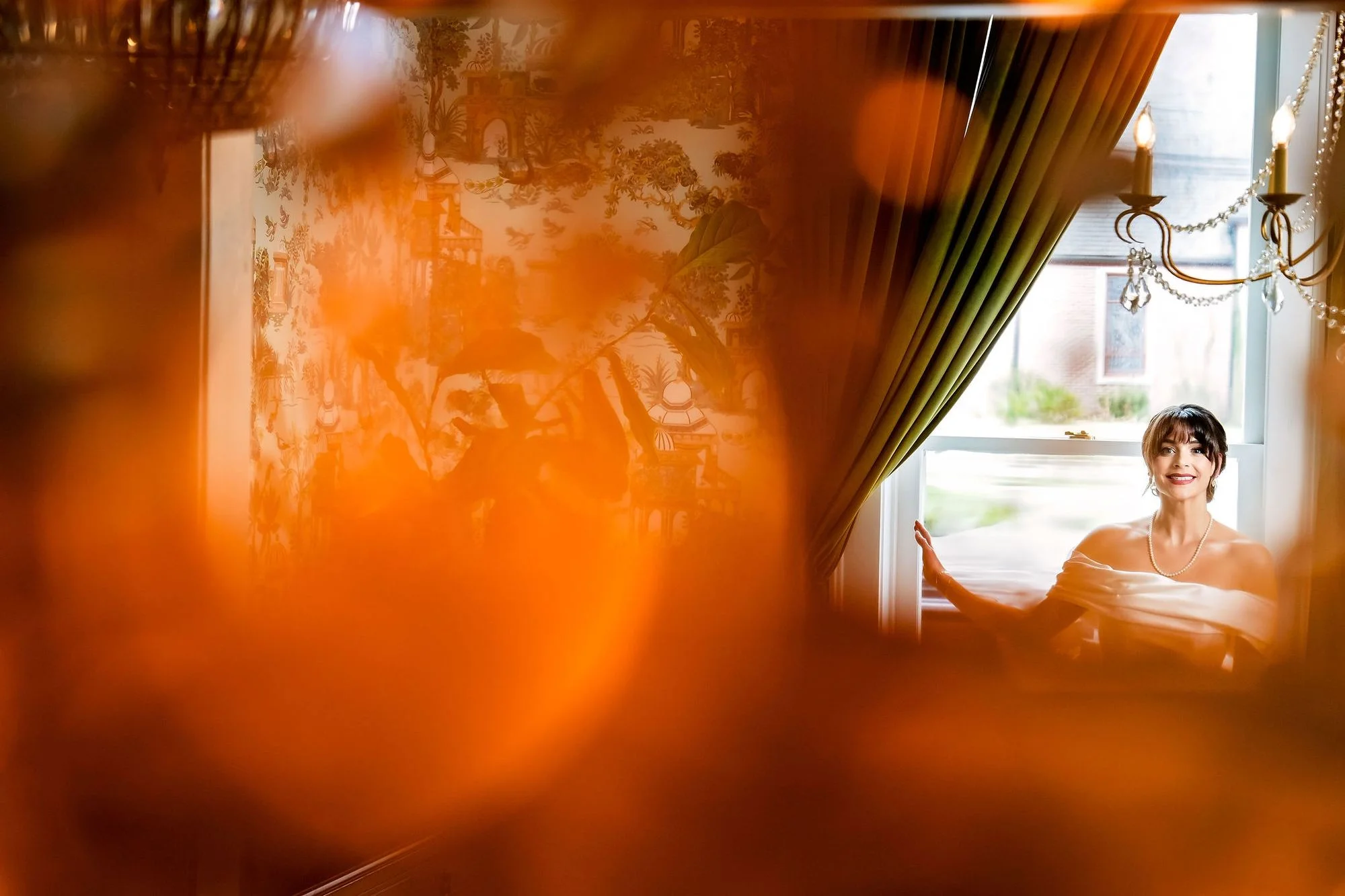 Soft amber abstract of the couple through glass