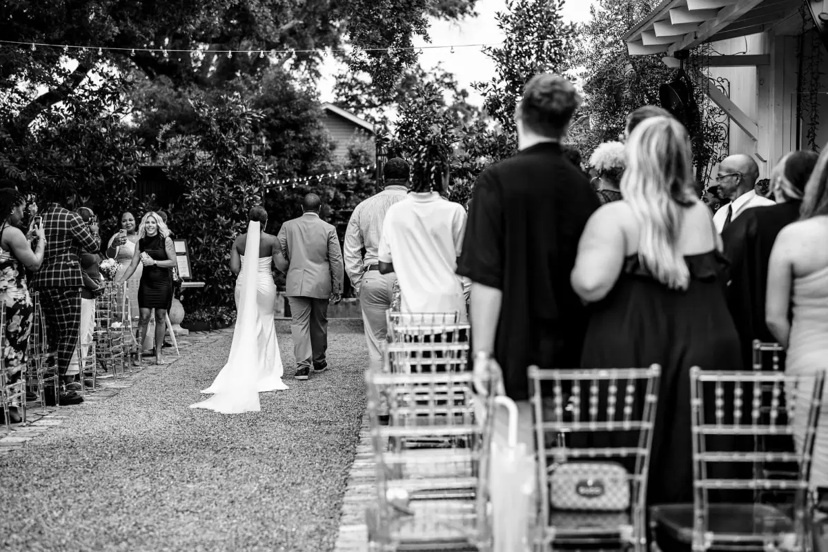 Black-and-white ceremony from the back of the aisle