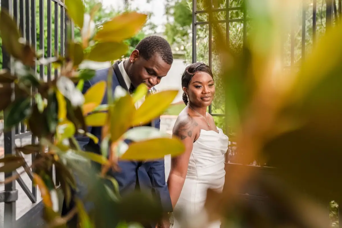 Couple kissing among the palms