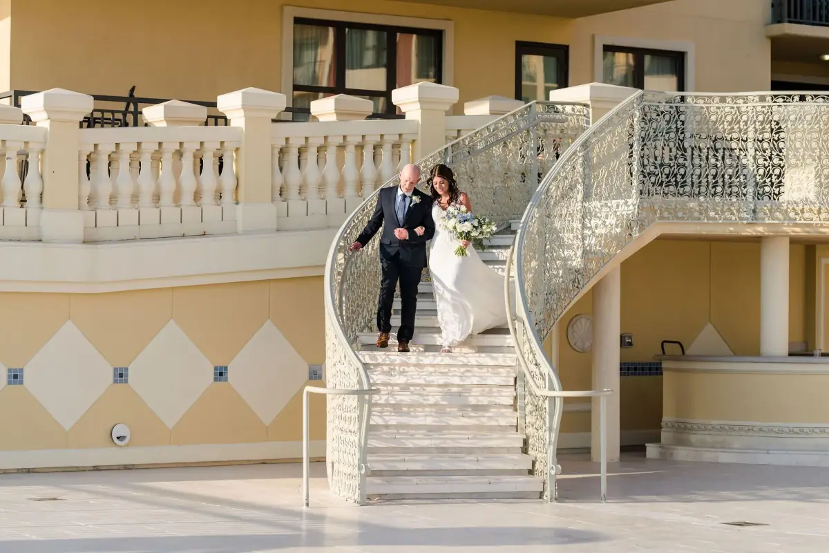 Couple on the grand white staircase