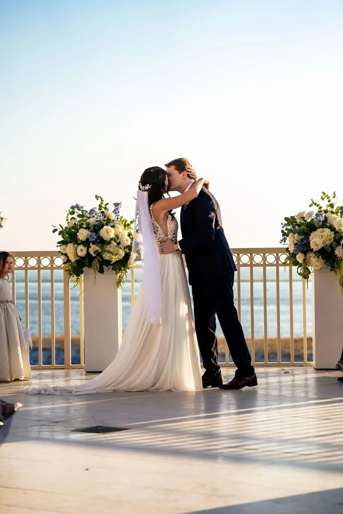 Couple kissing on the flower-lined terrace