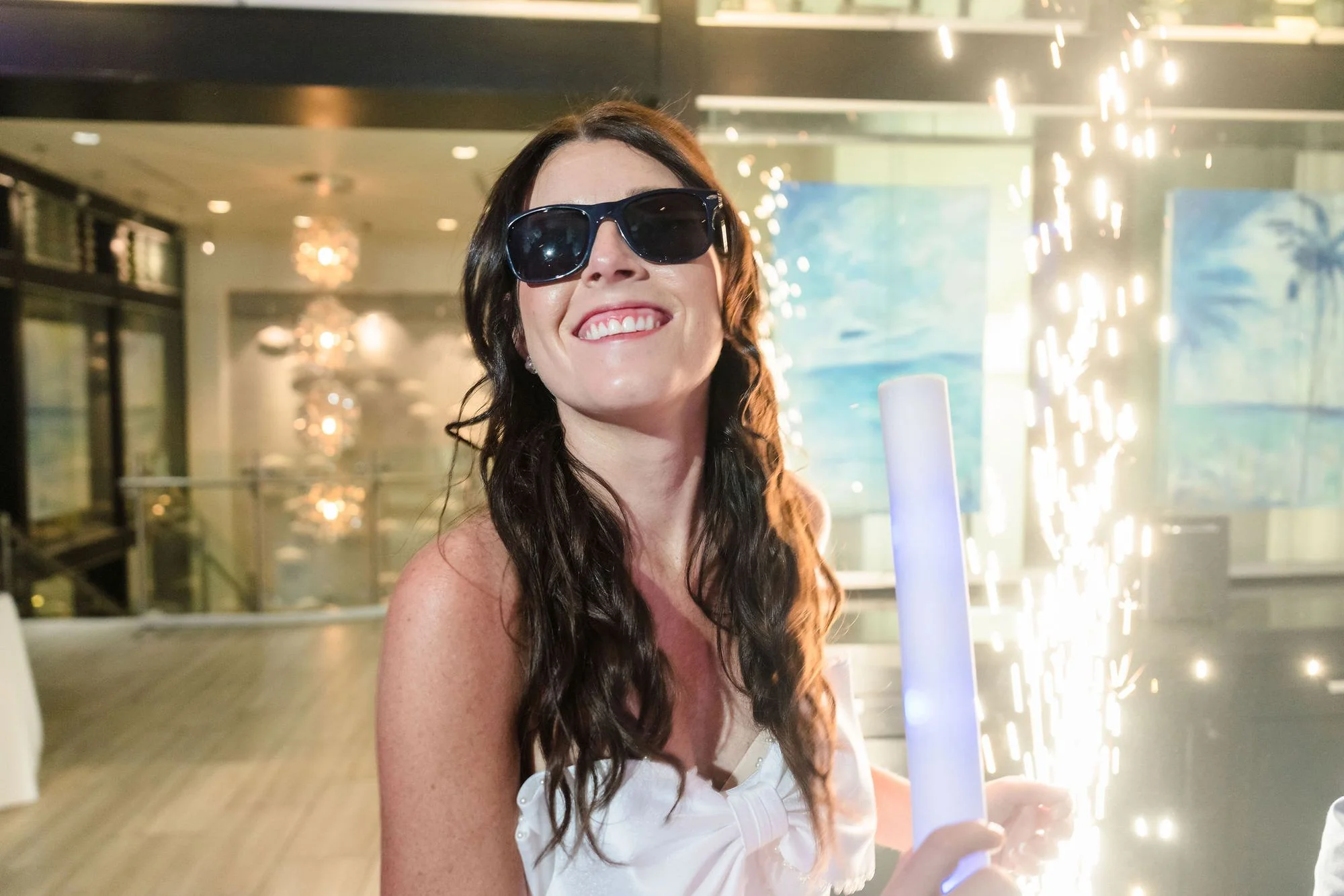 Bride in sunglasses with sparklers