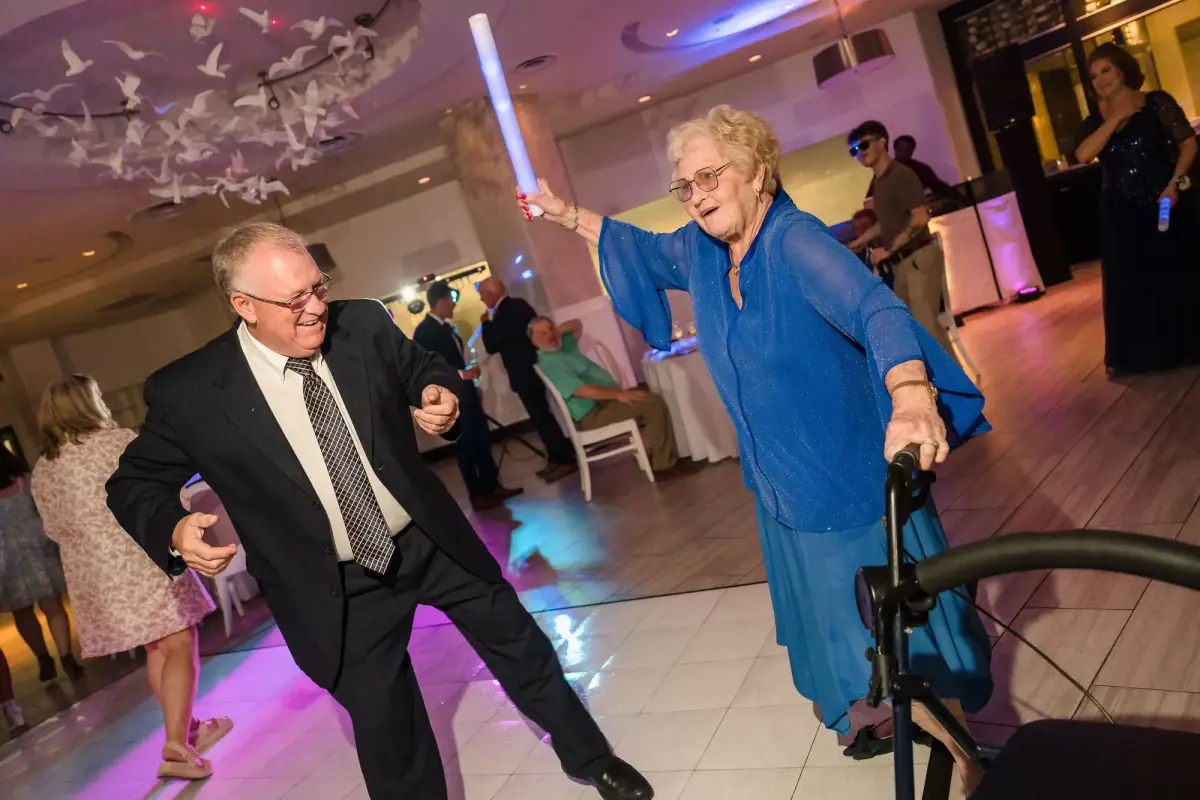 Guests dancing under purple light