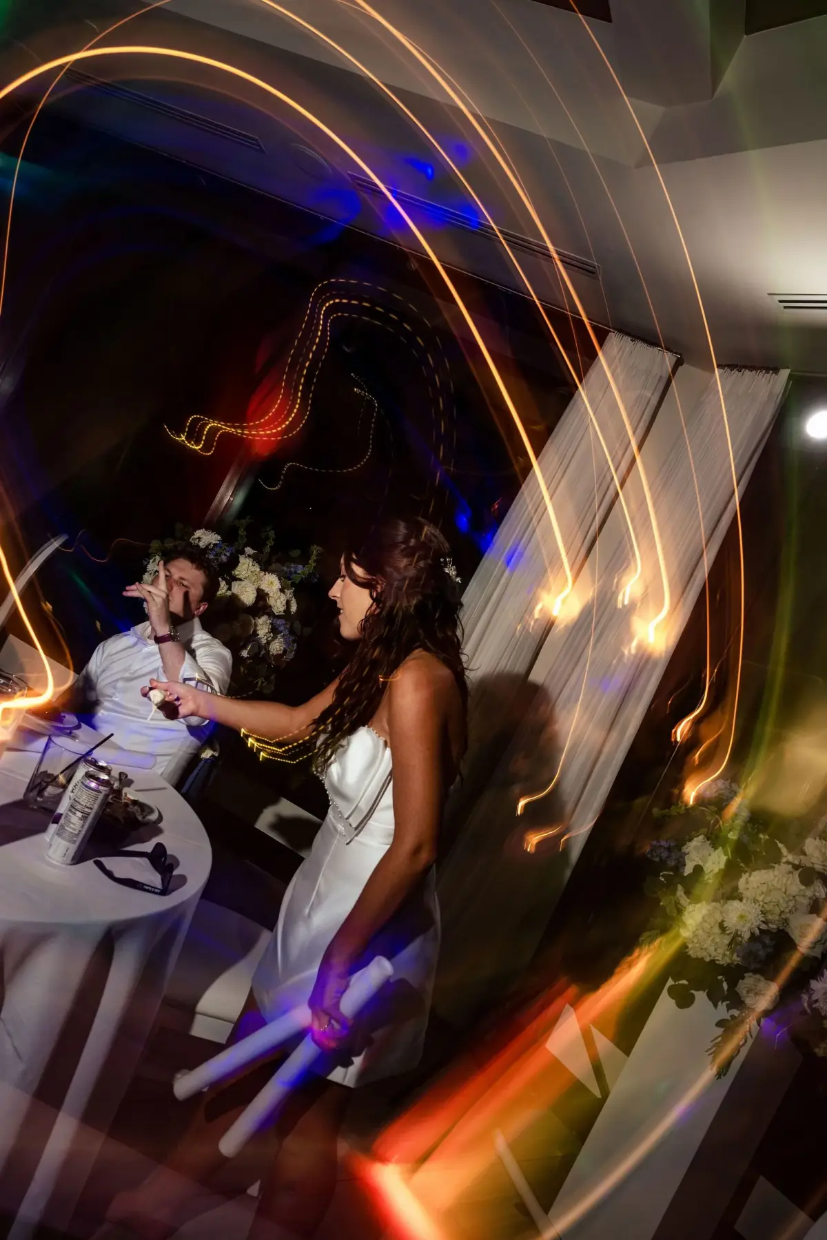 Couple dancing in a swirl of color
