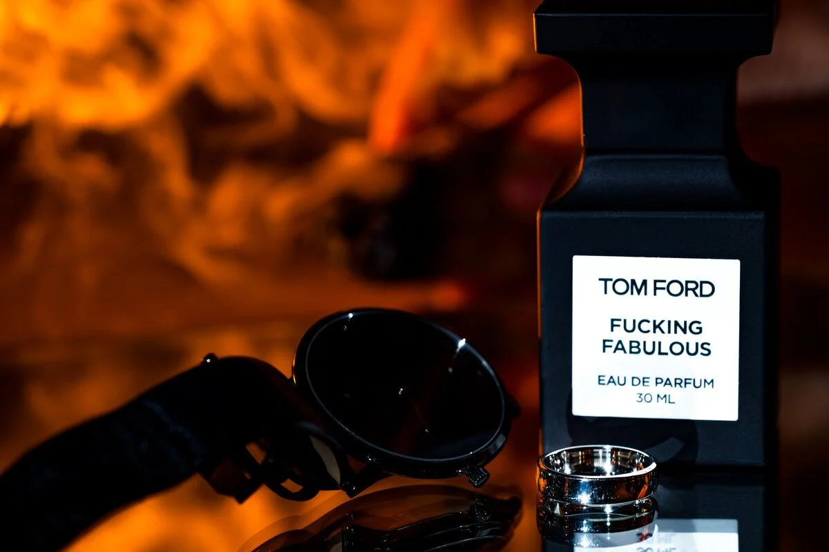A fragrance bottle glowing in warm light