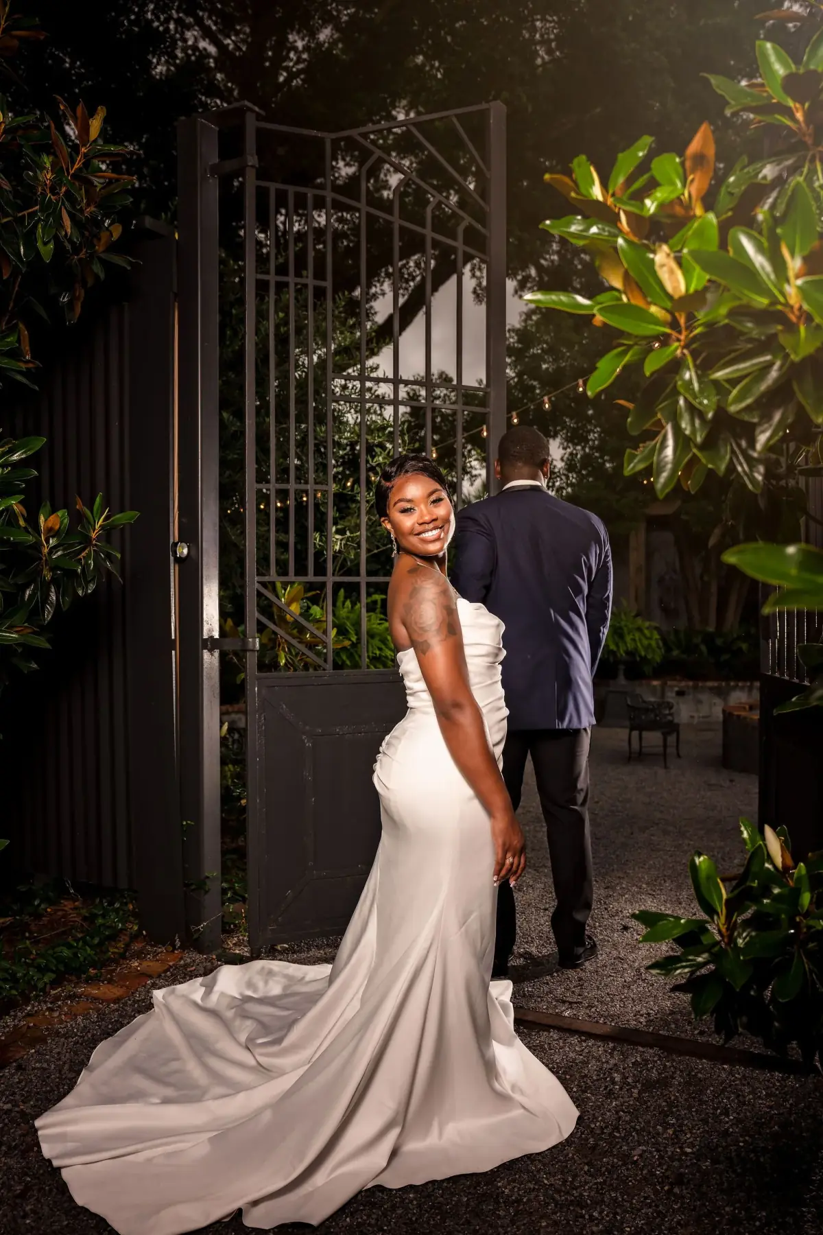 Bride in white among the greenery at night