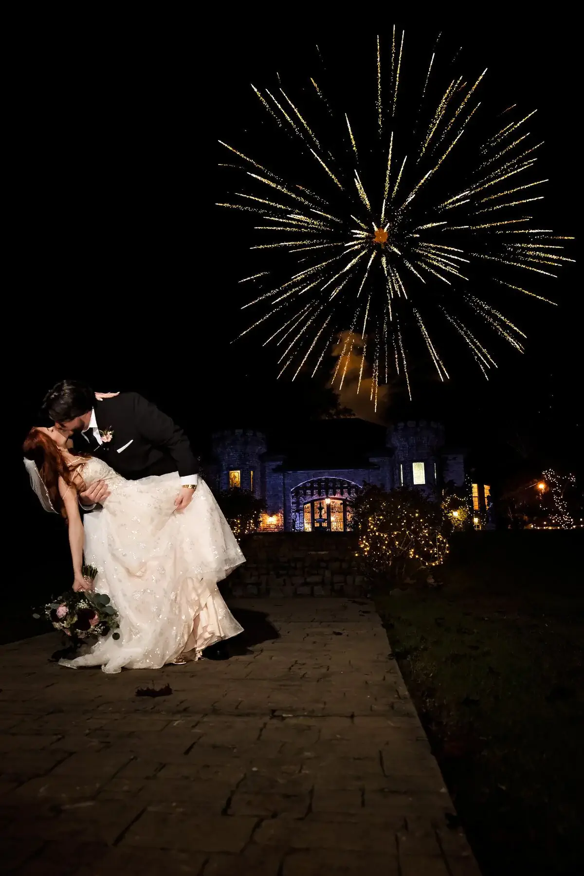 Fireworks blooming over the couple