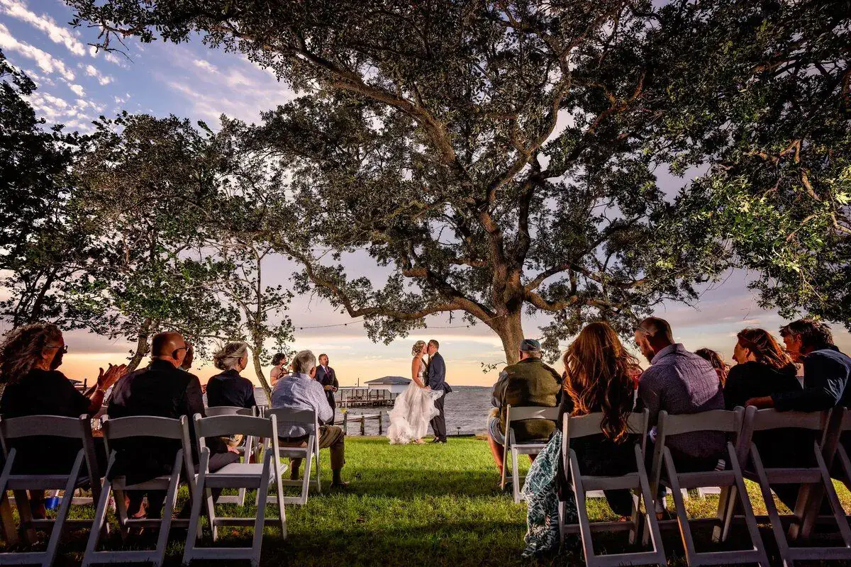 Ceremony under the oak at dusk