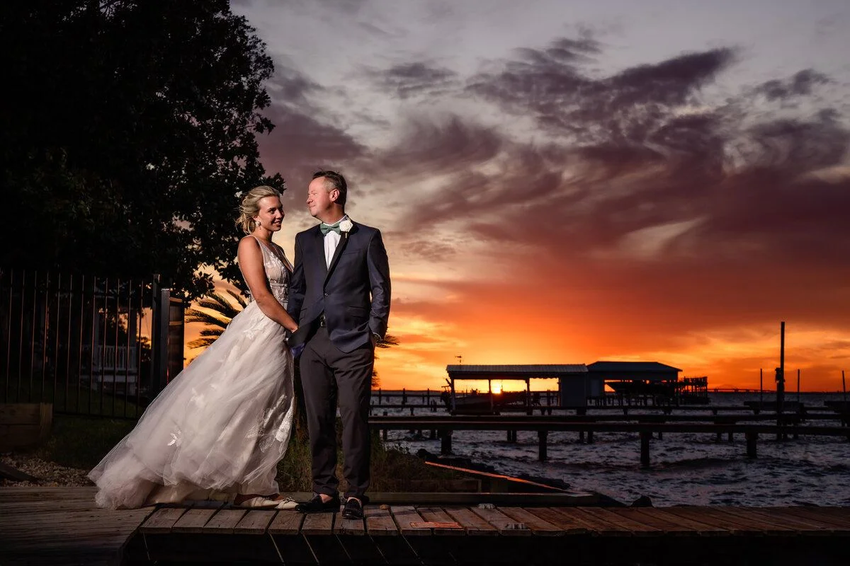 Couple silhouetted at a fiery sunset