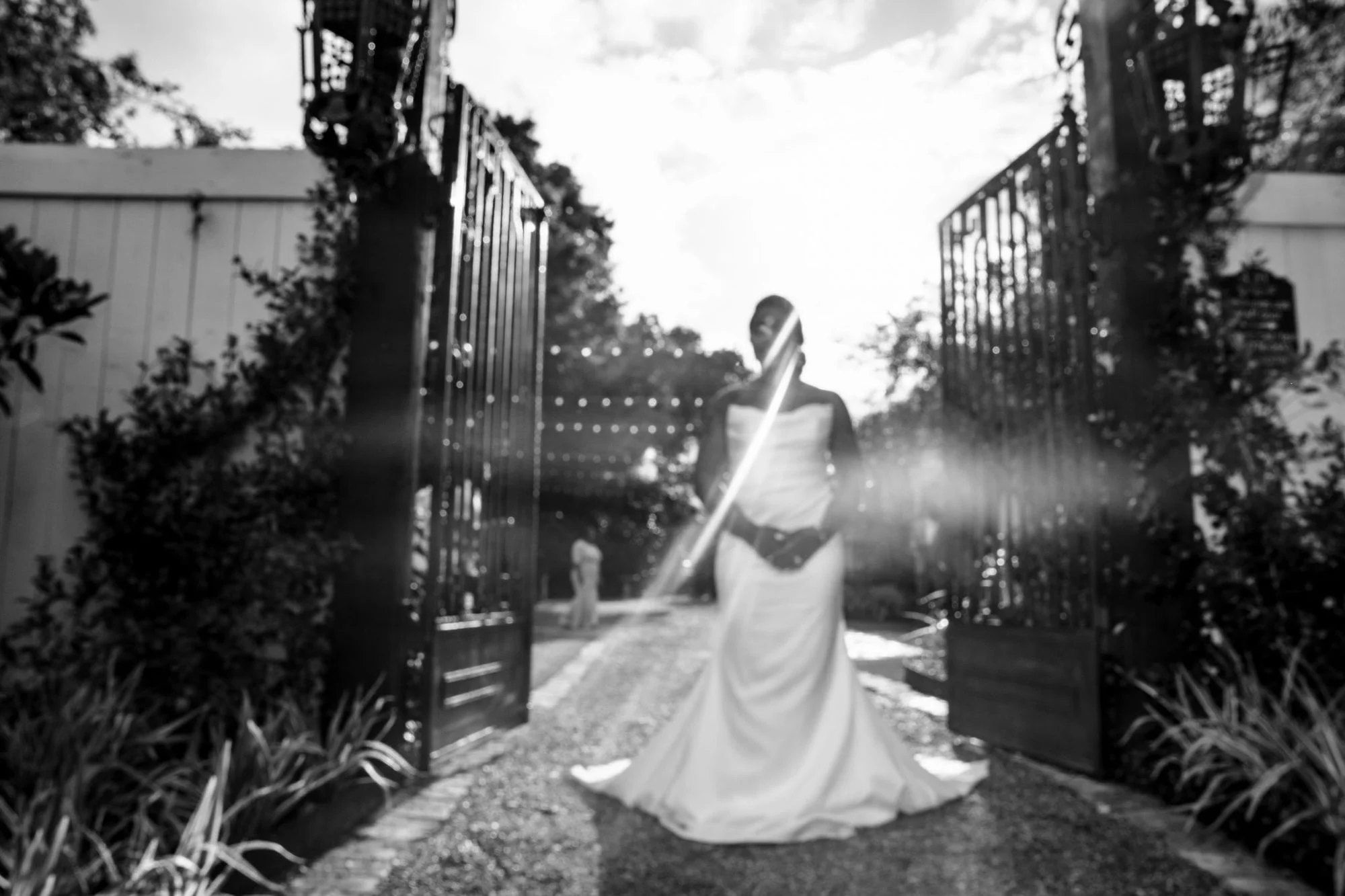 Black-and-white bride at the iron gates