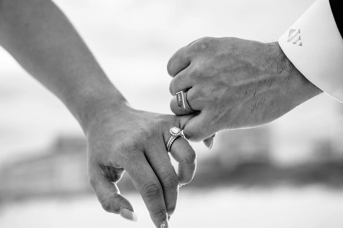 Black-and-white clasp of hands