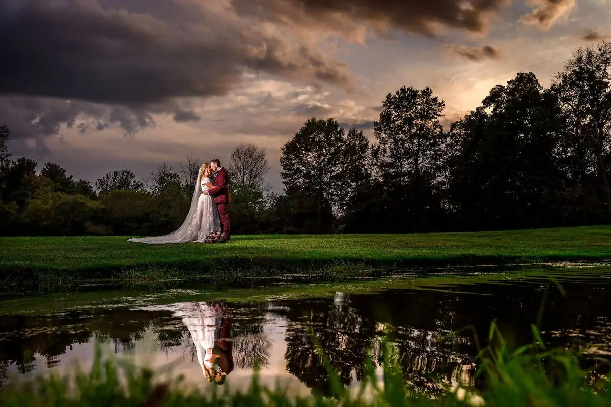 Couple dancing on the lawn at dusk