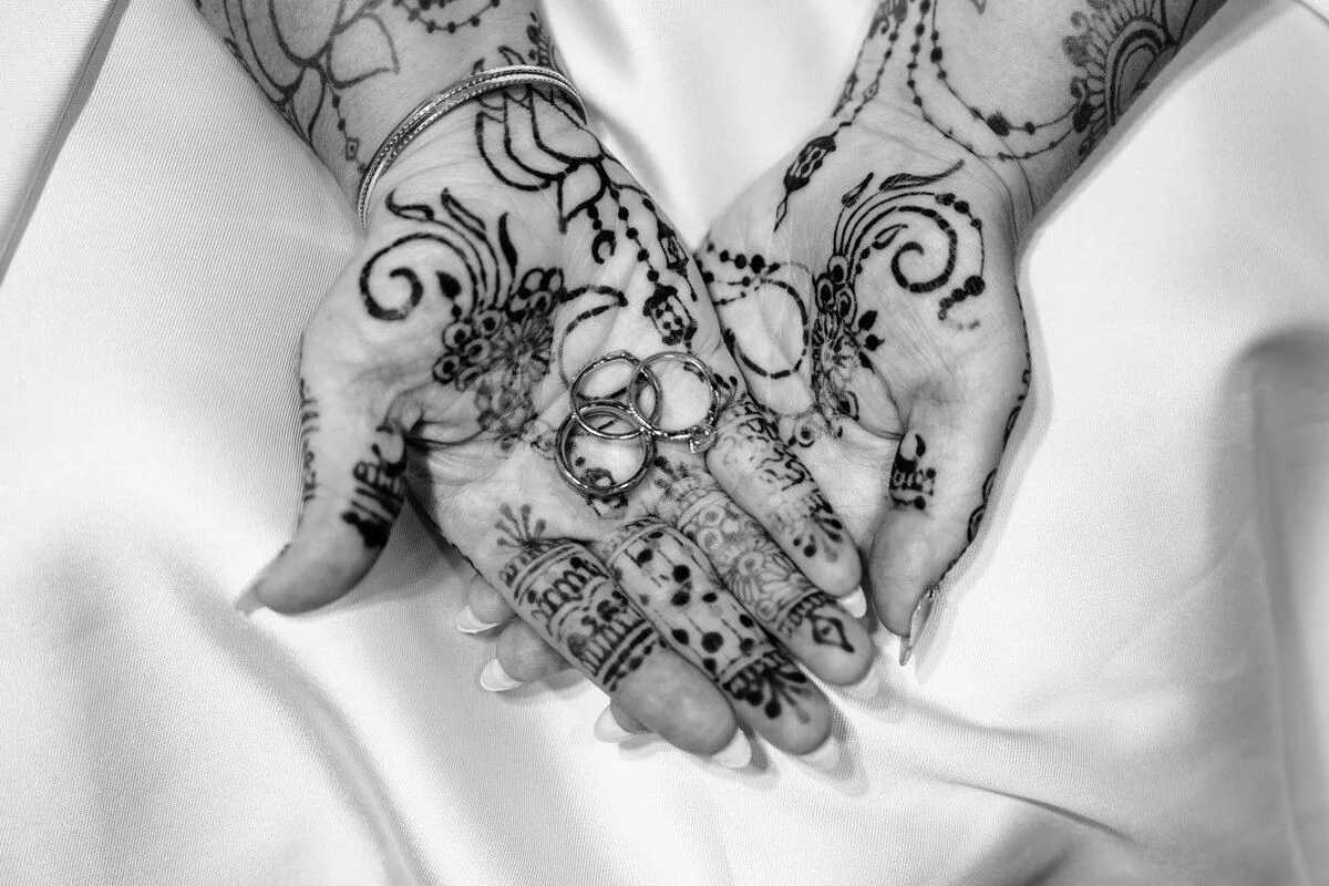 Black-and-white henna detail on the gown