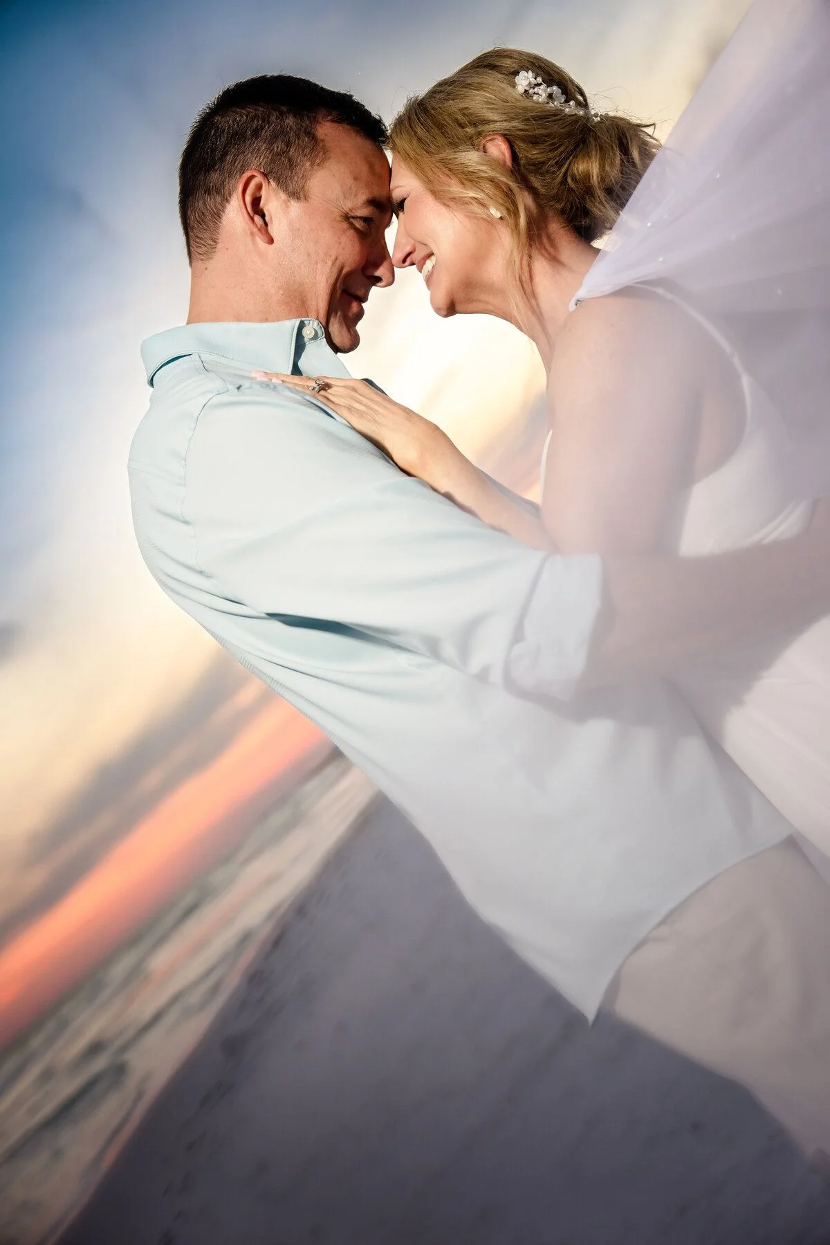 Couple embracing in a streak of sunlight
