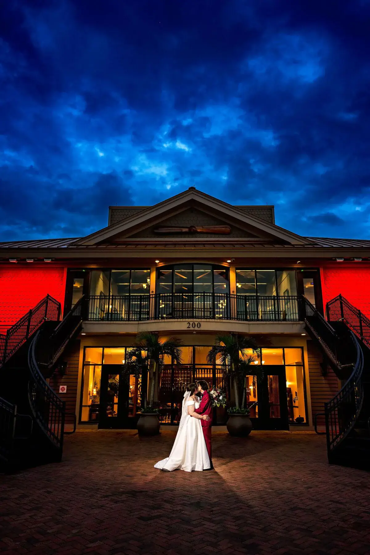 The lit venue glowing at blue hour