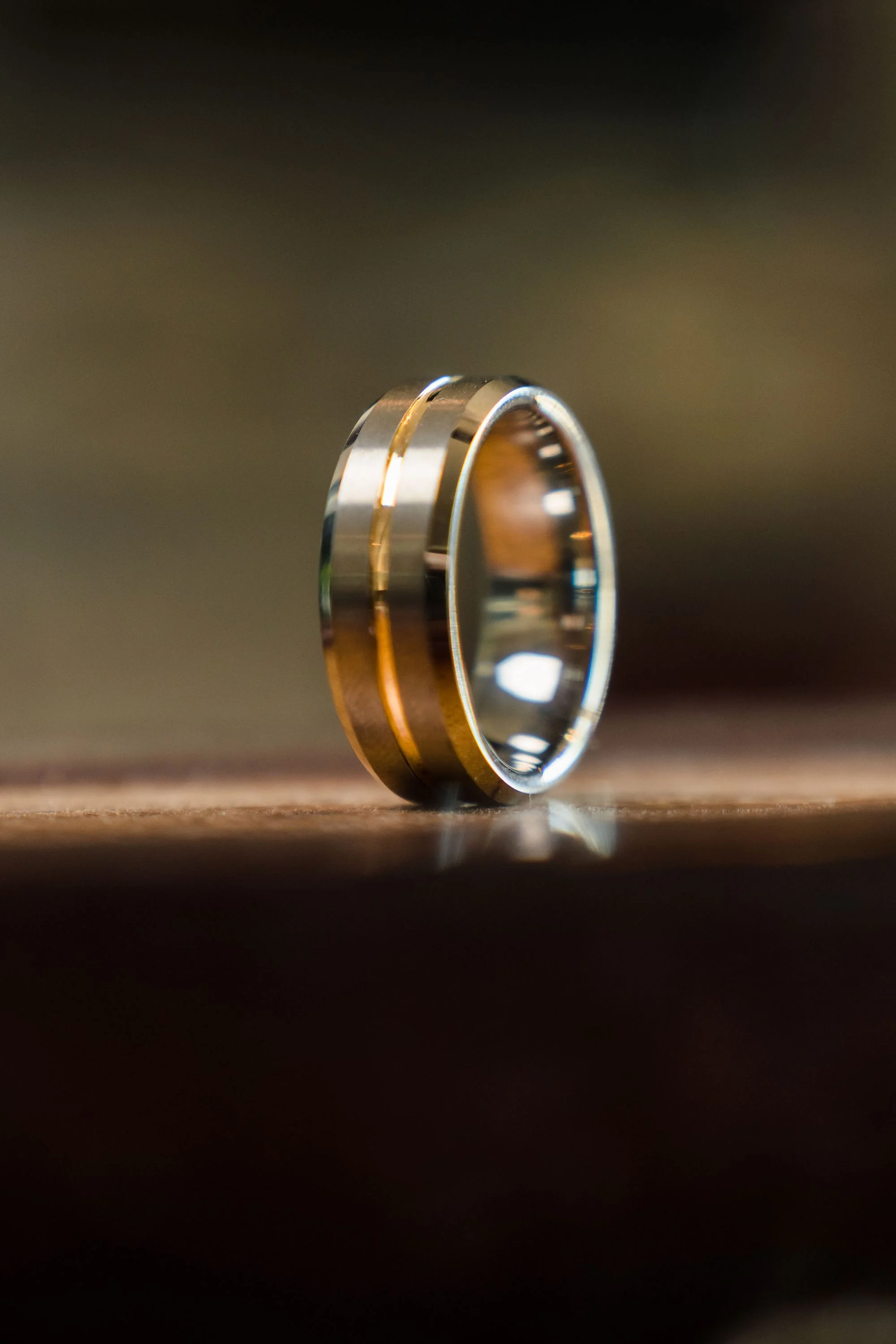 Single gold band on a dark surface