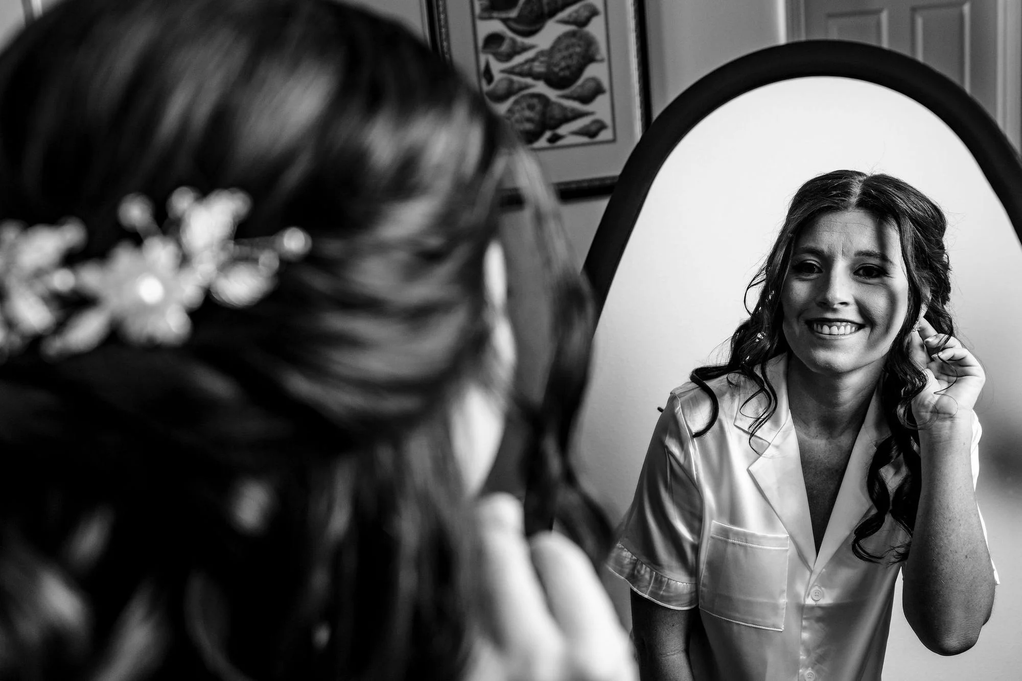Black-and-white bride at the mirror getting ready
