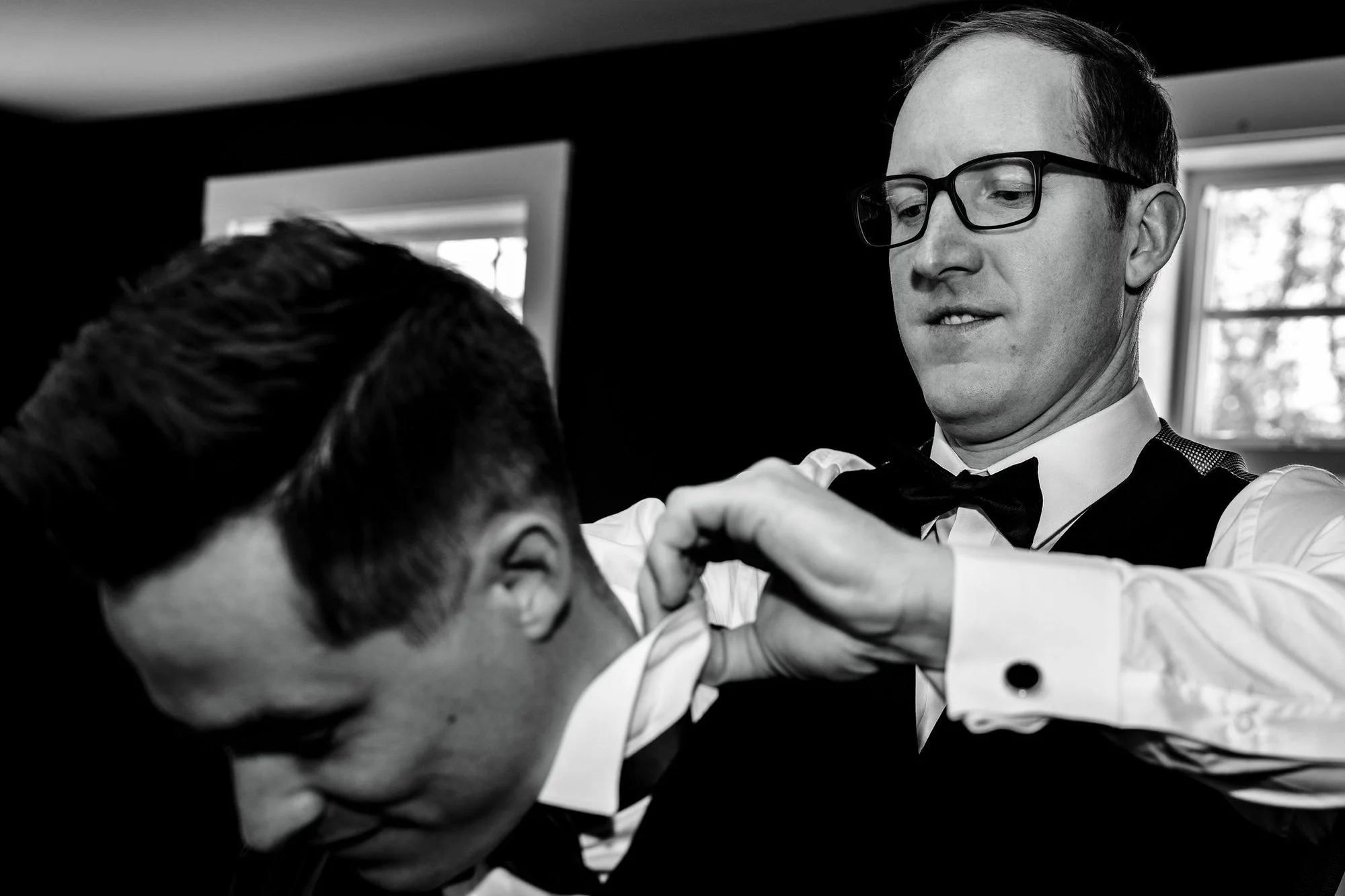 Fastening cufflinks during the final getting-ready moments