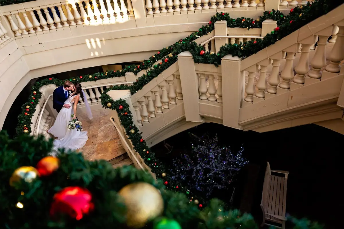 Garland-wrapped staircase dressed for a winter celebration
