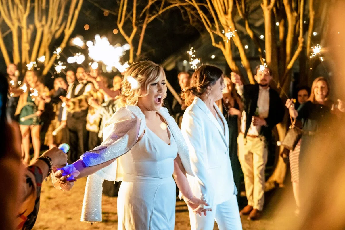 Newlyweds glow under strands of golden bistro lights