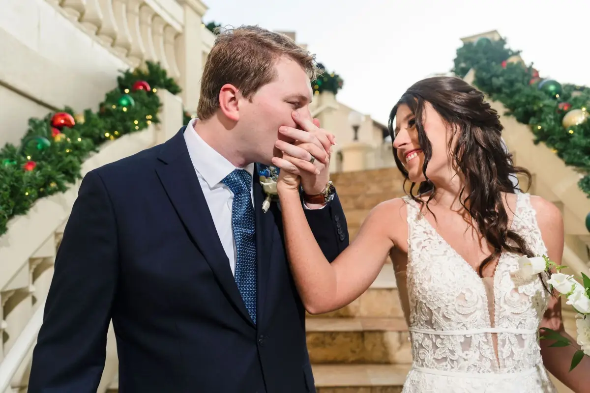 A playful bite of cake on the garland-trimmed steps
